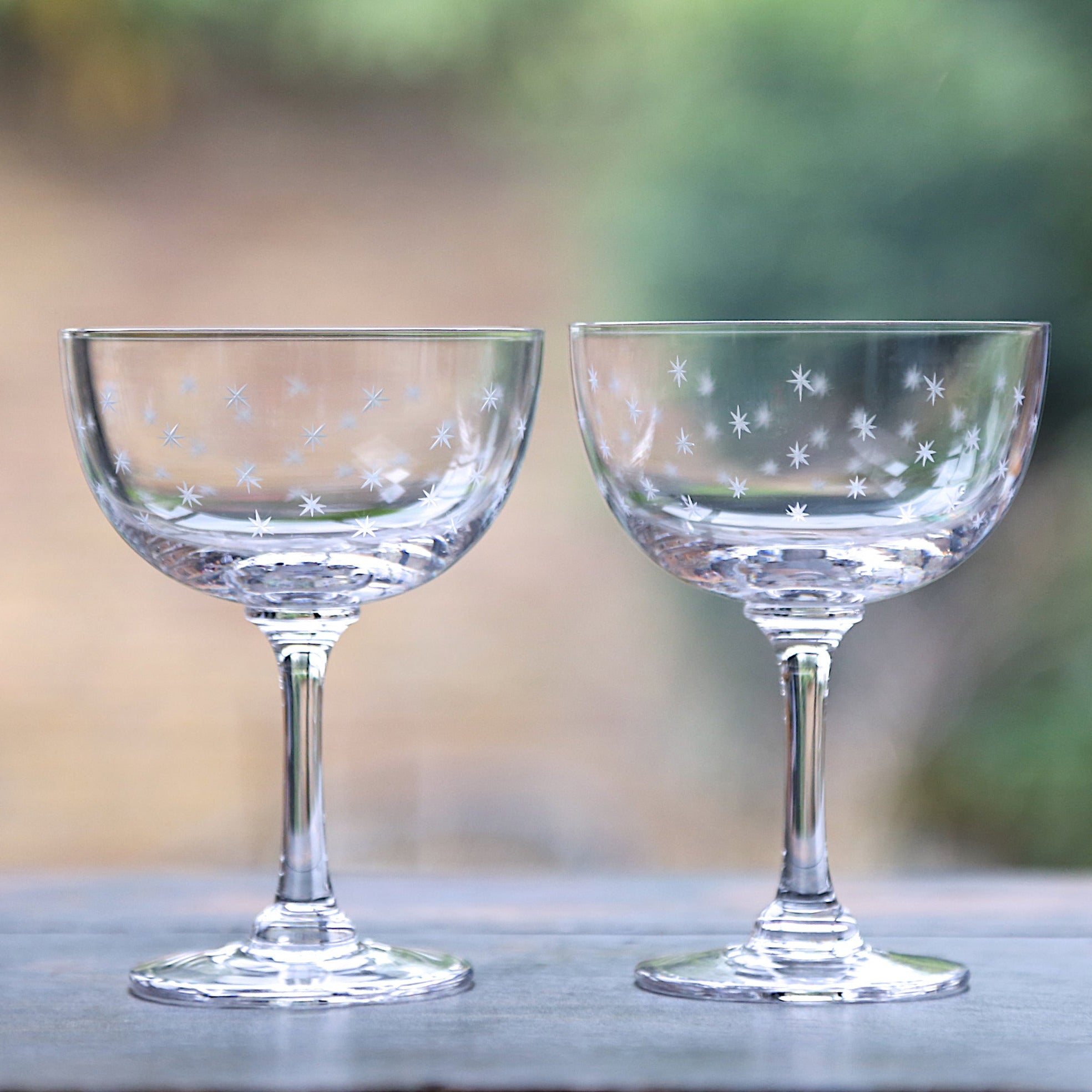 A Pair of Crystal Champagne Saucers with Stars Design