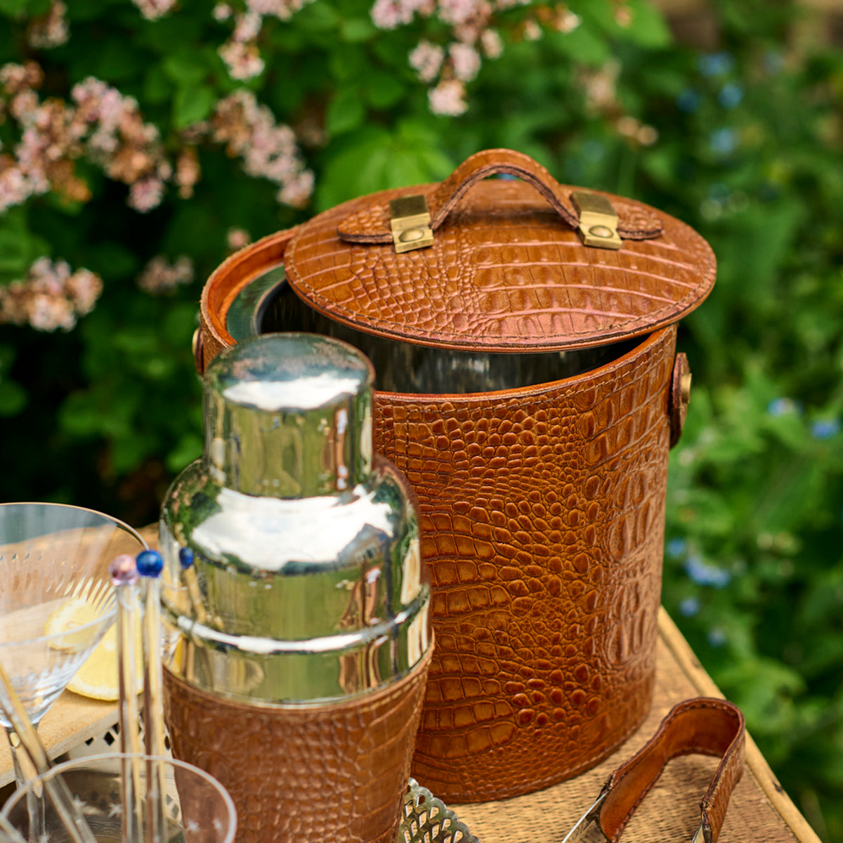 A Leather Ice Bucket with Tongs