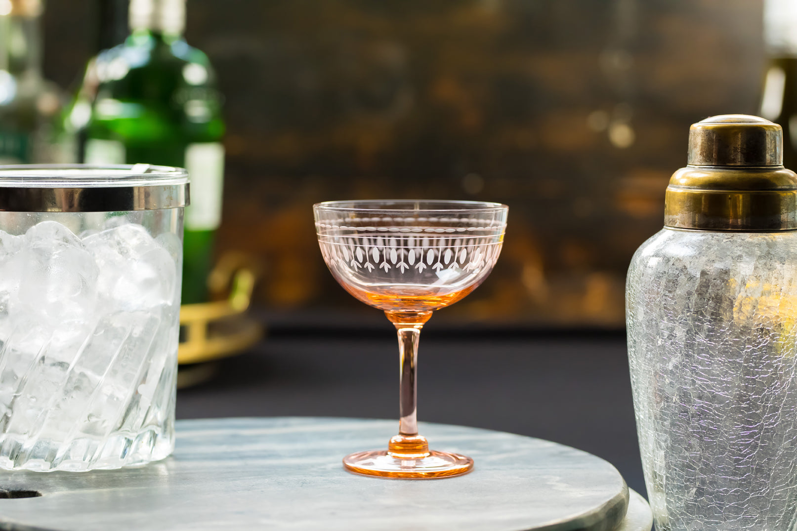 a set of four rose champagne saucers with ovals design