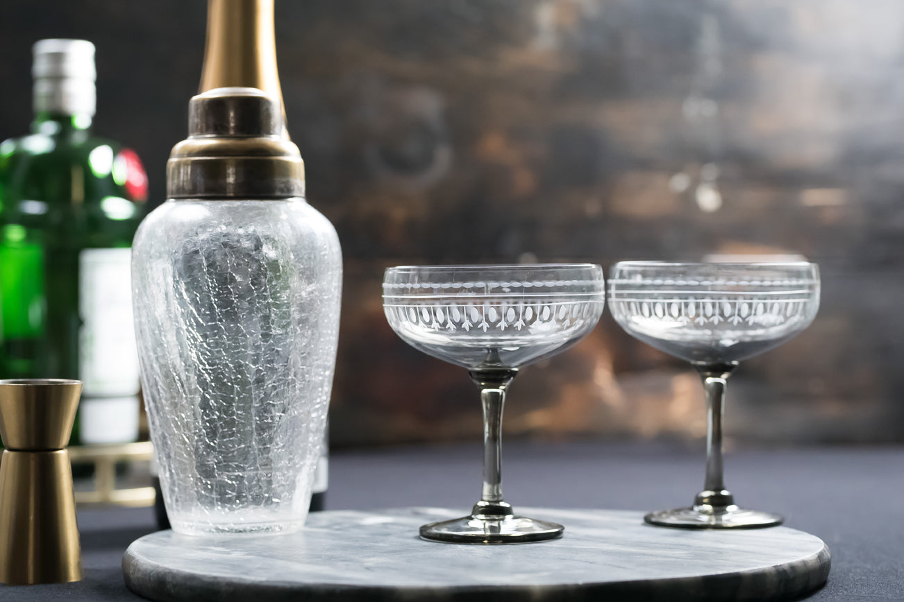 four smoky crystal cocktail glasses with ovals design