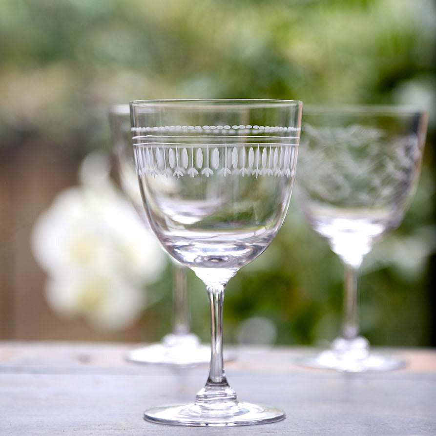 A Pair of Crystal Wine Glasses with Ovals Design