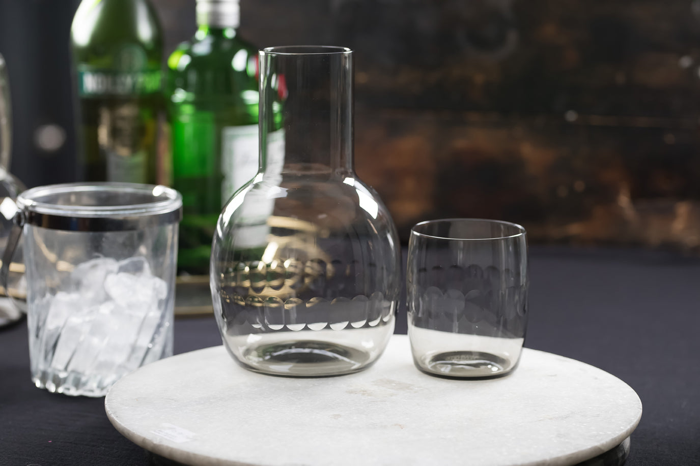 A smoky crystal carafe set with lens design