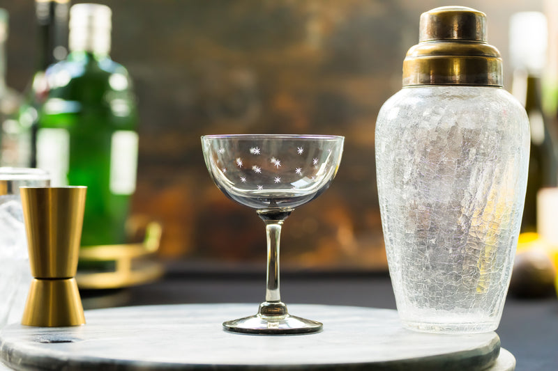 four smoky crystal champagne saucers with stars design