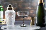 four smoky crystal cocktail glasses with stars design