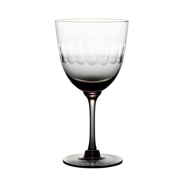 four smoky crystal wine glasses with lens design