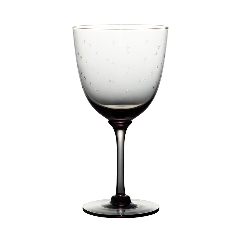 four smoky crystal wine glasses with stars design