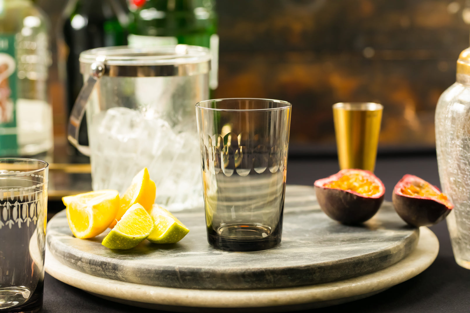 four smoky crystal tumblers with lens design
