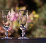 A Set of Four Crystal Champagne Flutes with Lens Design