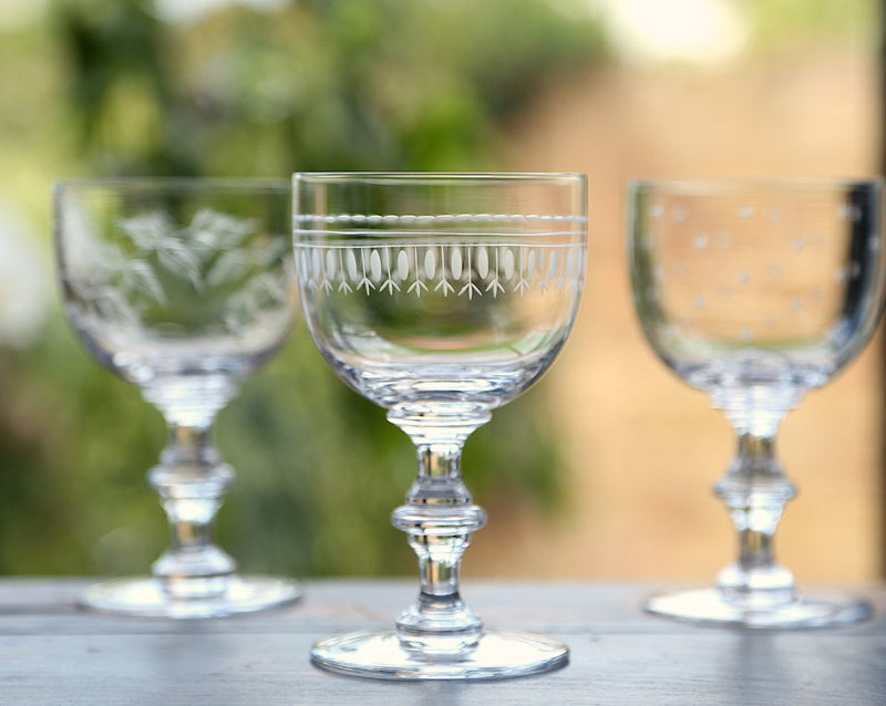 A Set Of Four Crystal Wine Goblets with Ovals Design