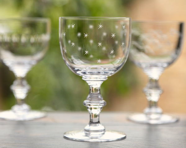 A Set Of Four Crystal Wine Goblets with Stars Design